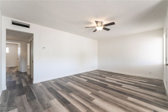 600 Berry Cir, Las Vegas, NV 89107 - empty room with ceiling fan, dark wood-style flooring, and a textured ceiling