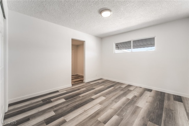 600 Berry Cir, Las Vegas, NV 89107 - spare room featuring wood finished floors and a textured ceiling