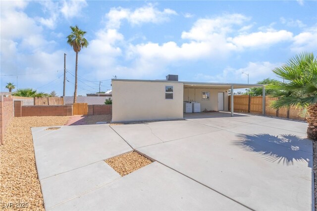 600 Berry Cir, Las Vegas, NV 89107 - rear view of property featuring a fenced backyard, stucco siding, and a patio area
