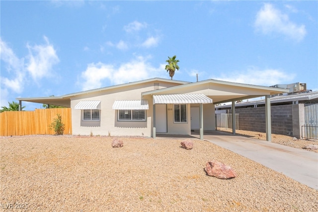 600 Berry Cir, Las Vegas, NV 89107 - view of front of property with driveway, a carport, and stucco siding