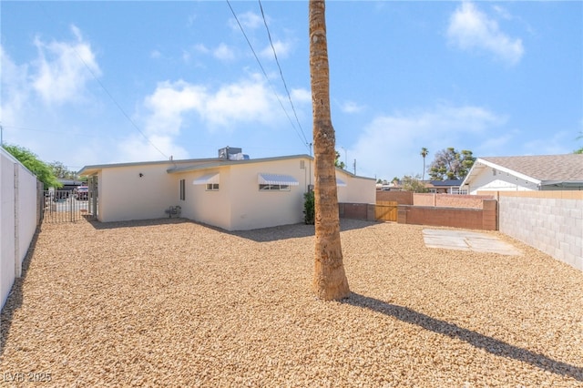 600 Berry Cir, Las Vegas, NV 89107 - back of property with a fenced backyard and stucco siding