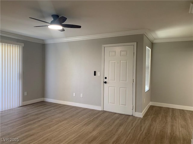 8101 W Flamingo Rd Unit 1102, Las Vegas, NV 89147 - spare room featuring wood finished floors, a ceiling fan, and crown molding