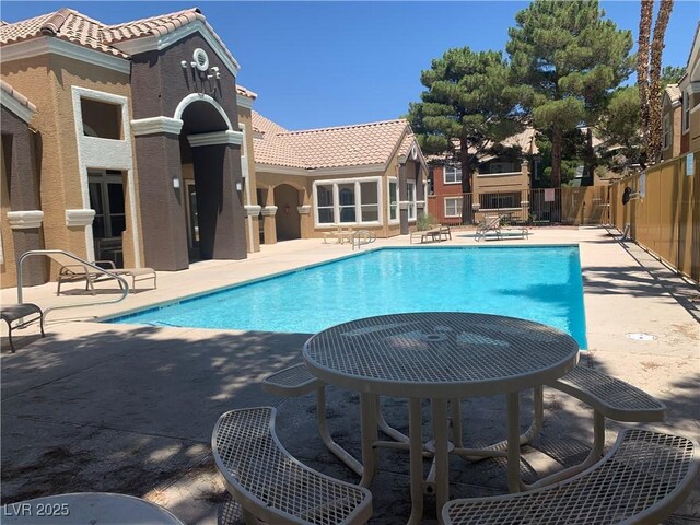 8101 W Flamingo Rd Unit 1102, Las Vegas, NV 89147 - community pool with a patio