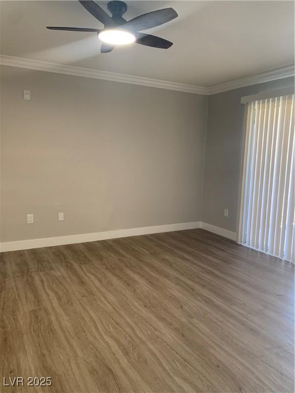 8101 W Flamingo Rd Unit 1102, Las Vegas, NV 89147 - spare room featuring crown molding, ceiling fan, and wood finished floors