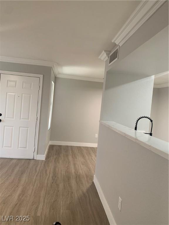 8101 W Flamingo Rd Unit 1102, Las Vegas, NV 89147 - corridor featuring wood finished floors and crown molding