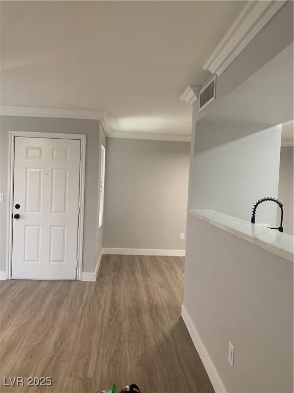 8101 W Flamingo Rd Unit 1102, Las Vegas, NV 89147 - corridor with wood finished floors and crown molding