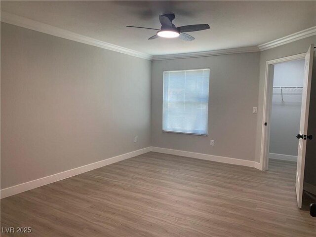 8101 W Flamingo Rd Unit 1102, Las Vegas, NV 89147 - empty room with ornamental molding, wood finished floors, and ceiling fan