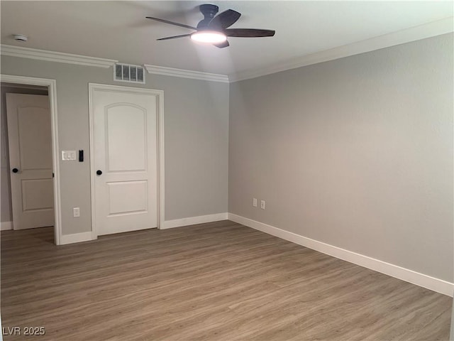 8101 W Flamingo Rd Unit 1102, Las Vegas, NV 89147 - unfurnished room with a ceiling fan, light wood finished floors, ornamental molding, and a smoke detector