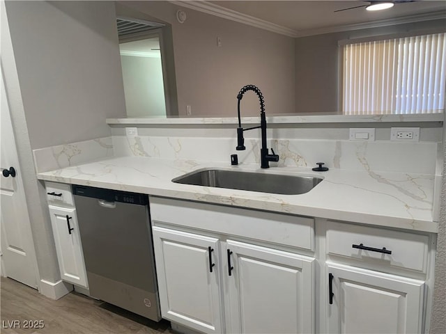 8101 W Flamingo Rd Unit 1102, Las Vegas, NV 89147 - kitchen with dishwasher, crown molding, white cabinets, light wood finished floors, and light stone counters