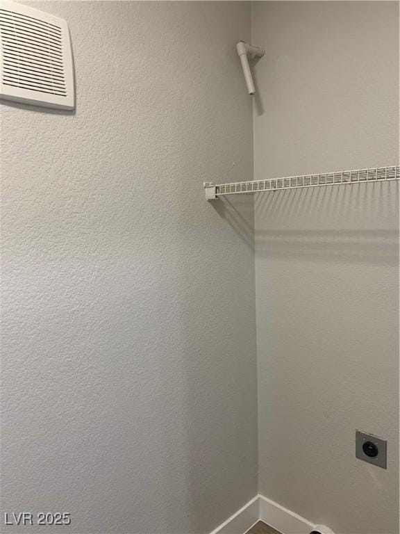 8101 W Flamingo Rd Unit 1102, Las Vegas, NV 89147 - laundry area featuring hookup for an electric dryer and baseboards