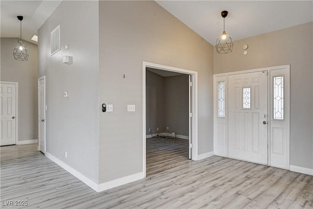 8517 Soneto Ln, Las Vegas, NV 89117 - entrance foyer with high vaulted ceiling and light wood-type flooring