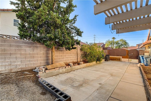 8517 Soneto Ln, Las Vegas, NV 89117 - fenced backyard featuring a gate and a patio area