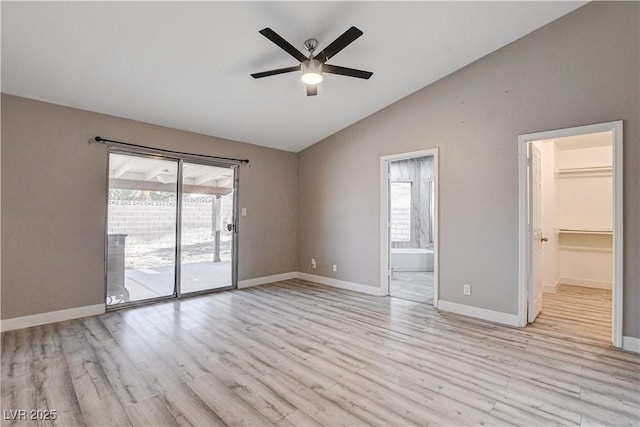 8517 Soneto Ln, Las Vegas, NV 89117 - unfurnished room with vaulted ceiling, a ceiling fan, and light wood-style flooring