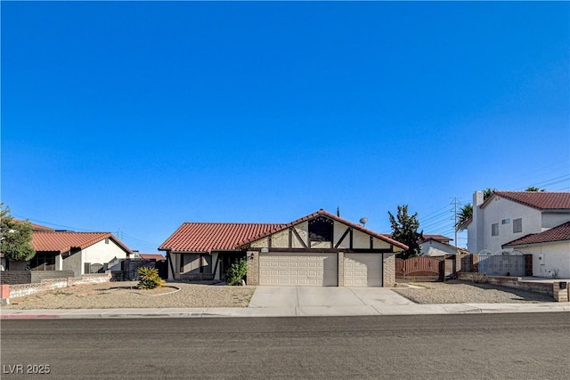 8517 Soneto Ln, Las Vegas, NV 89117 - english style home with a garage, driveway, and a tiled roof