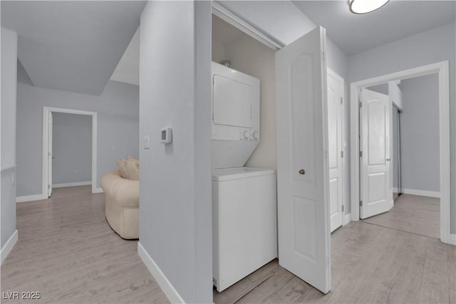 2305 W Horizon Ridge Parkway Unit 611, Henderson, NV 89052 - laundry area featuring stacked washer / dryer and light wood-style flooring