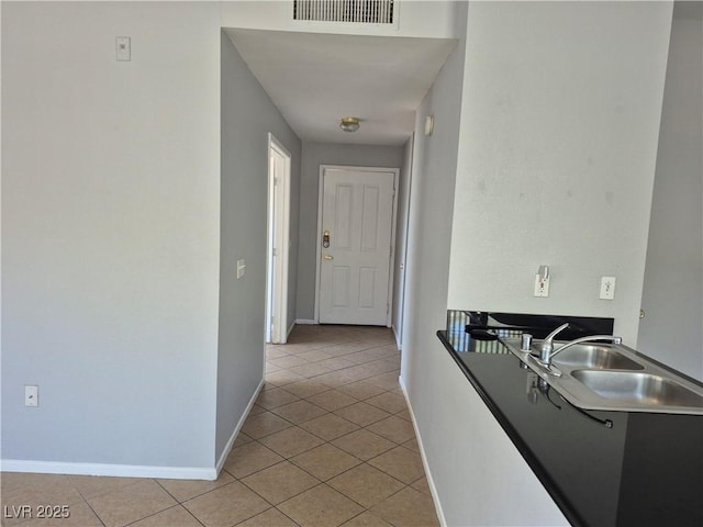 2900 Sunridge Heights Pkwy Unit 418, Henderson, NV 89052 - hallway with a sink and light tile patterned flooring