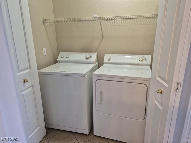 2900 Sunridge Heights Pkwy Unit 418, Henderson, NV 89052 - washroom with separate washer and dryer and light tile patterned floors