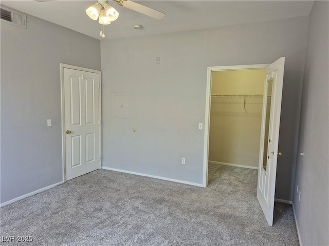 2900 Sunridge Heights Pkwy Unit 418, Henderson, NV 89052 - unfurnished bedroom featuring carpet, a walk in closet, a closet, and ceiling fan