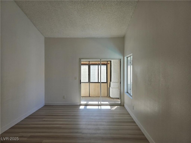 6636 Old Oxford Ave, Las Vegas, NV 89108 - spare room featuring wood finished floors and a textured ceiling