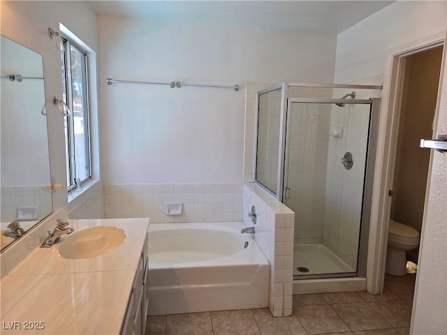 6636 Old Oxford Ave, Las Vegas, NV 89108 - bathroom featuring tile patterned flooring, a shower stall, a bath, and vanity
