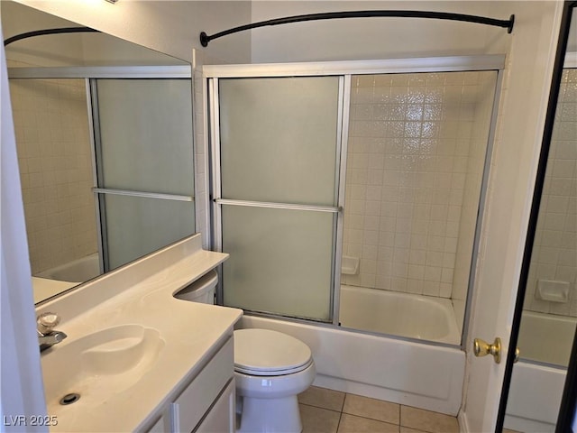 6636 Old Oxford Ave, Las Vegas, NV 89108 - bathroom with tile patterned flooring, vanity, and enclosed tub / shower combo