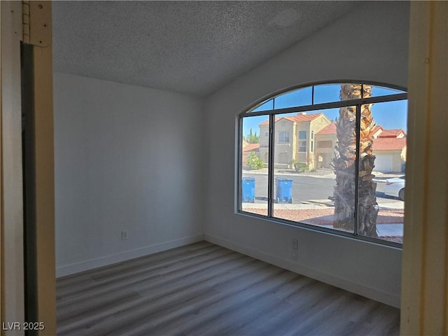 6636 Old Oxford Ave, Las Vegas, NV 89108 - unfurnished room with wood finished floors and a textured ceiling