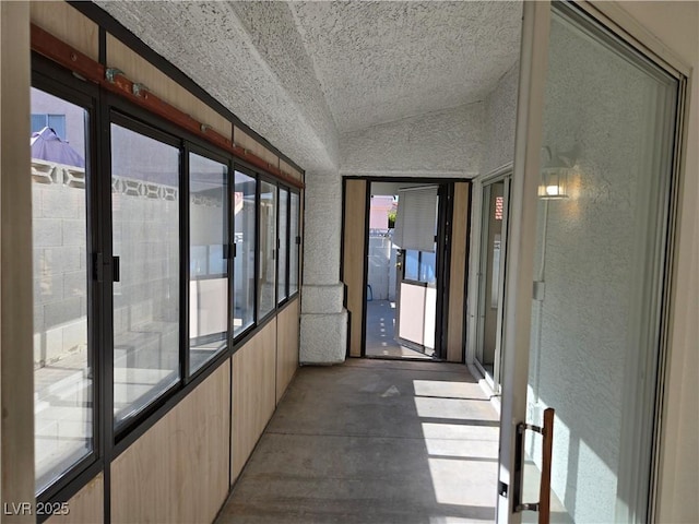 6636 Old Oxford Ave, Las Vegas, NV 89108 - hall with vaulted ceiling, healthy amount of natural light, and a textured wall