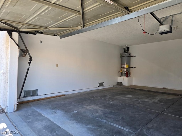 6636 Old Oxford Ave, Las Vegas, NV 89108 - garage featuring strapped water heater and a garage door opener