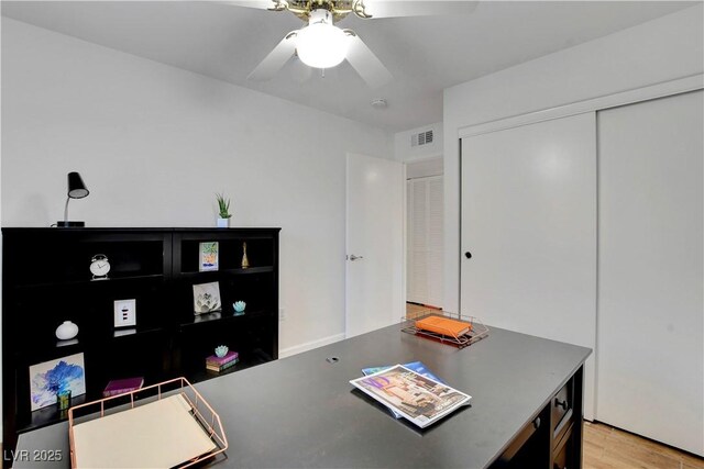 7950 W Flamingo Rd Unit 1042, Las Vegas, NV 89147 - office area with a ceiling fan and light wood-style flooring