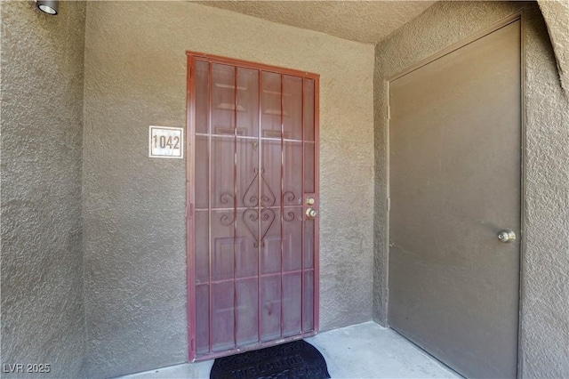 7950 W Flamingo Rd Unit 1042, Las Vegas, NV 89147 - doorway to property featuring stucco siding