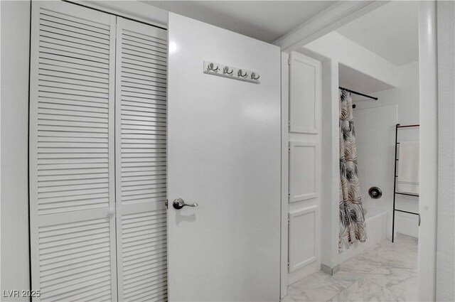 7950 W Flamingo Rd Unit 1042, Las Vegas, NV 89147 - full bath featuring marble look tile flooring, a closet, and shower / bath combo