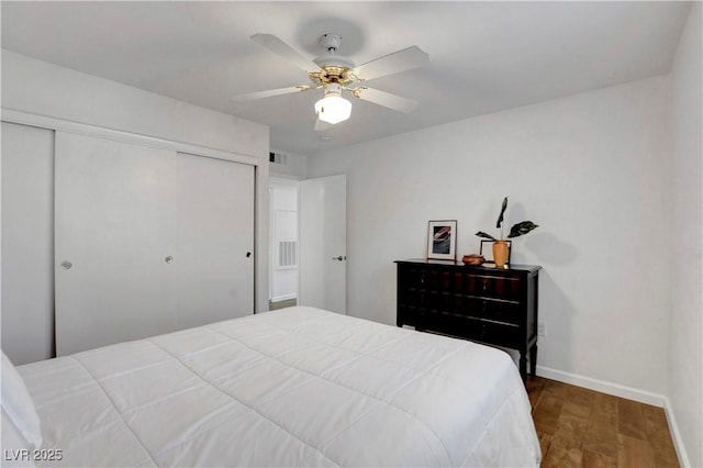 7950 W Flamingo Rd Unit 1042, Las Vegas, NV 89147 - bedroom with a closet, wood finished floors, and a ceiling fan
