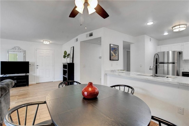 7950 W Flamingo Rd Unit 1042, Las Vegas, NV 89147 - dining room with ceiling fan, light wood-type flooring, and recessed lighting