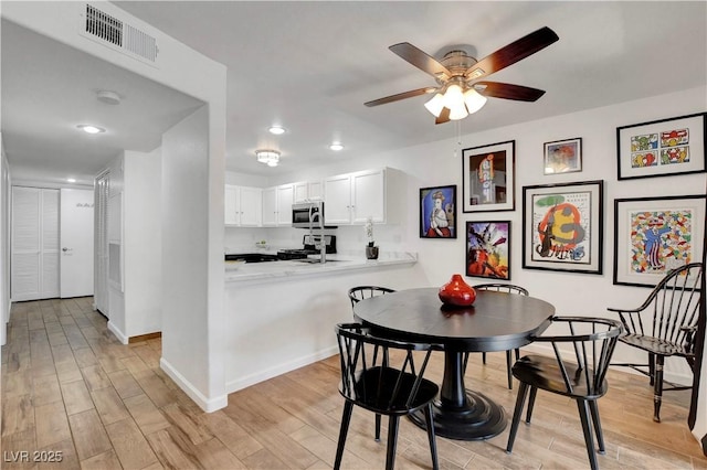 7950 W Flamingo Rd Unit 1042, Las Vegas, NV 89147 - dining area featuring light wood-type flooring, recessed lighting, and a ceiling fan