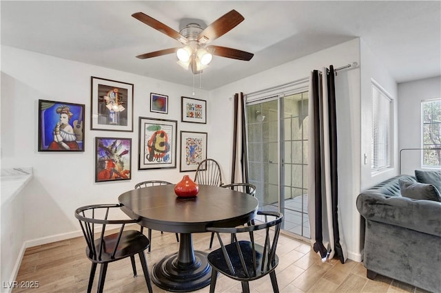 7950 W Flamingo Rd Unit 1042, Las Vegas, NV 89147 - dining room featuring a ceiling fan and light wood-style flooring