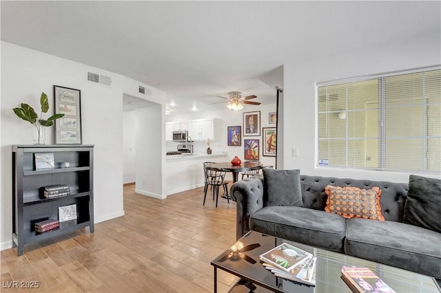 7950 W Flamingo Rd Unit 1042, Las Vegas, NV 89147 - living room with light wood-style flooring and a ceiling fan