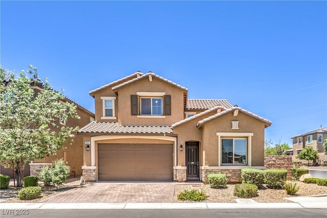 10961 Winter Rise St, Las Vegas, NV 89141 - view of front of home with stone siding, stucco siding, an attached garage, and a tile roof