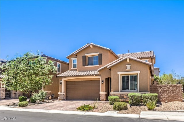 10961 Winter Rise St, Las Vegas, NV 89141 - view of front facade featuring a tile roof, a garage, stucco siding, decorative driveway, and stone siding