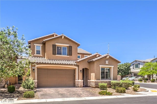 10961 Winter Rise St, Las Vegas, NV 89141 - mediterranean / spanish house featuring stone siding, stucco siding, an attached garage, and a tile roof