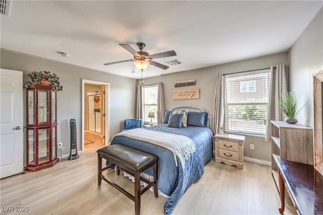 10961 Winter Rise St, Las Vegas, NV 89141 - bedroom with light wood-style flooring, a ceiling fan, and ensuite bath