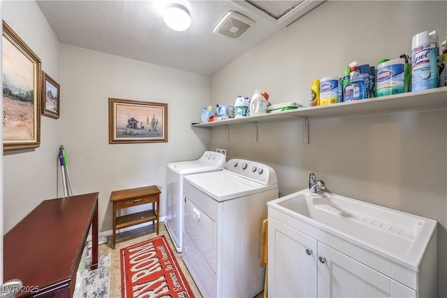 10961 Winter Rise St, Las Vegas, NV 89141 - laundry room featuring separate washer and dryer and cabinet space