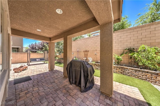 10961 Winter Rise St, Las Vegas, NV 89141 - fenced backyard with a patio and grilling area