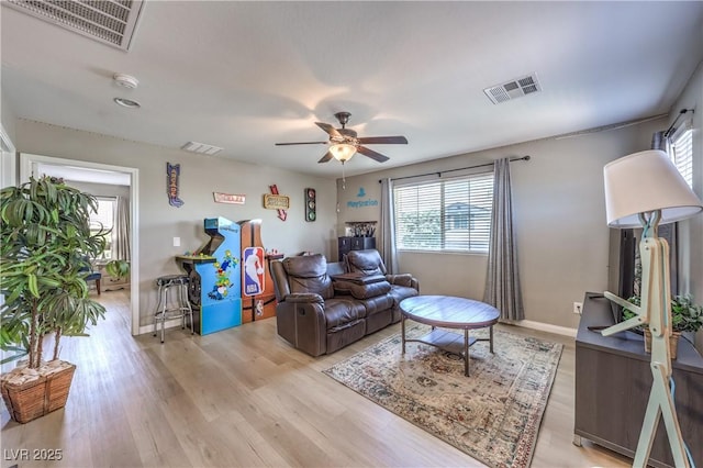 10961 Winter Rise St, Las Vegas, NV 89141 - living room featuring plenty of natural light, ceiling fan, and light wood-style floors