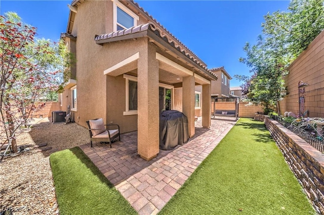 10961 Winter Rise St, Las Vegas, NV 89141 - back of property featuring stucco siding, a patio area, a fenced backyard, and a tiled roof