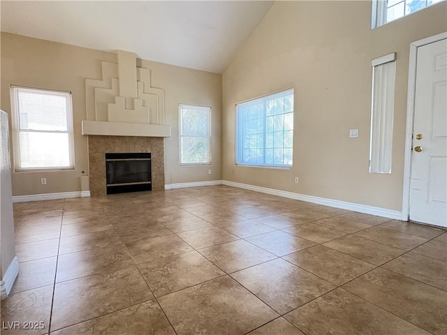 3679 Funston Way, Las Vegas, NV 89129 - unfurnished living room with high vaulted ceiling, tile patterned floors, and a tile fireplace