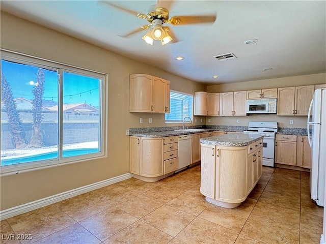 3679 Funston Way, Las Vegas, NV 89129 - kitchen featuring white appliances, a kitchen island, ceiling fan, recessed lighting, and light tile patterned flooring