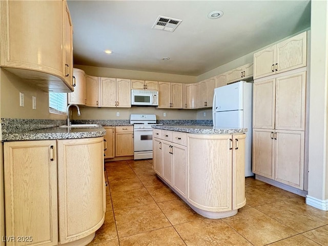 3679 Funston Way, Las Vegas, NV 89129 - kitchen featuring white appliances, light tile patterned floors, recessed lighting, stone countertops, and light brown cabinets