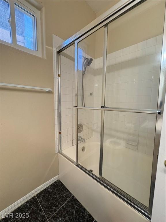 3679 Funston Way, Las Vegas, NV 89129 - bathroom featuring enclosed tub / shower combo and marble look tile flooring