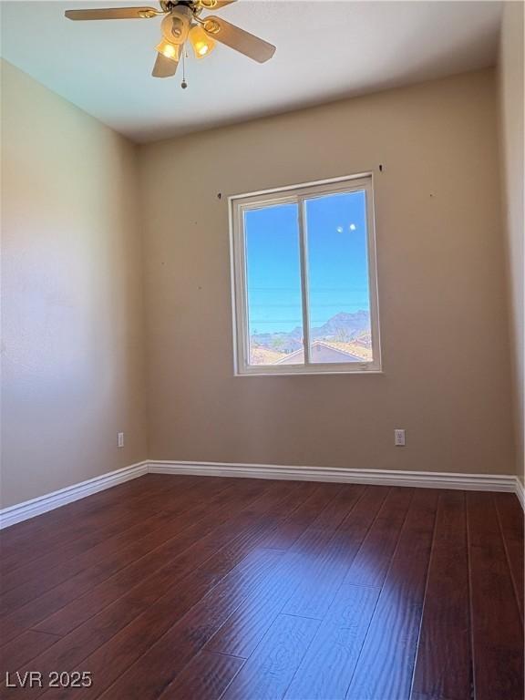 3679 Funston Way, Las Vegas, NV 89129 - spare room featuring dark wood-style flooring and ceiling fan