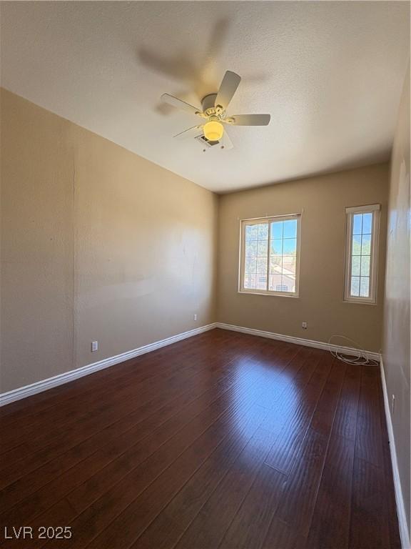 3679 Funston Way, Las Vegas, NV 89129 - unfurnished room featuring a ceiling fan and dark wood-style floors